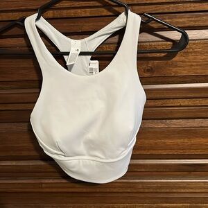 Brand New - size 4. Wunder Train Longline Bra for Medium Support C/D cup